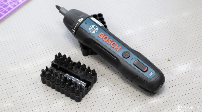 An electric screwdriver with several controls placed along the same upper surface.